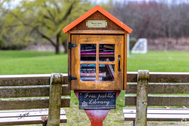 Discover the charm of Oakhust's park with its quaint Free Public Library.