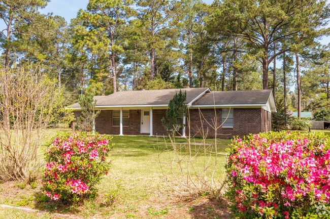 Brick ranch homes with blooming azaleas make the Cairo neighborhoods beautiful and desirable.