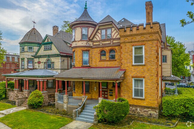 Older traditional Victorian-style homes line State Road in the West End neighborhood.