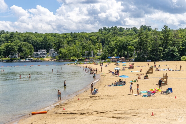 Beach goers at the Endicott Rock Park Beach at Weirs Beach in Laconia, NH.
