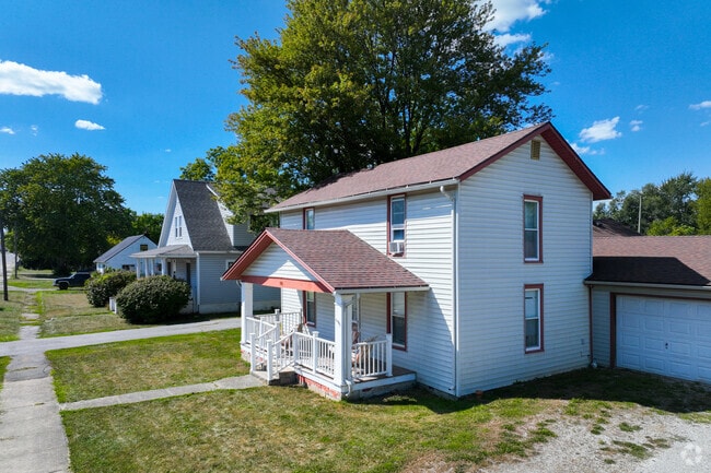 A cozy bungalow with a porch is located in Ossian.