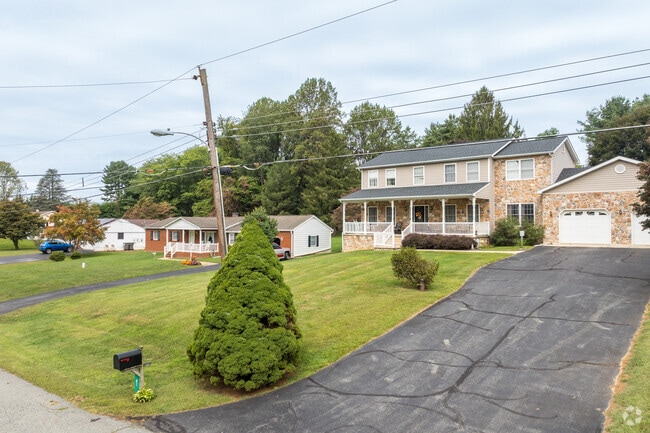 Residential streets in Rising Sun feature sidewalks and tree-lined yards.