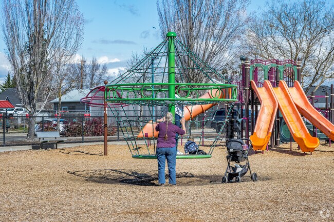 This family is enjoying the playground at Don Jones Memorial Park in Central Point.