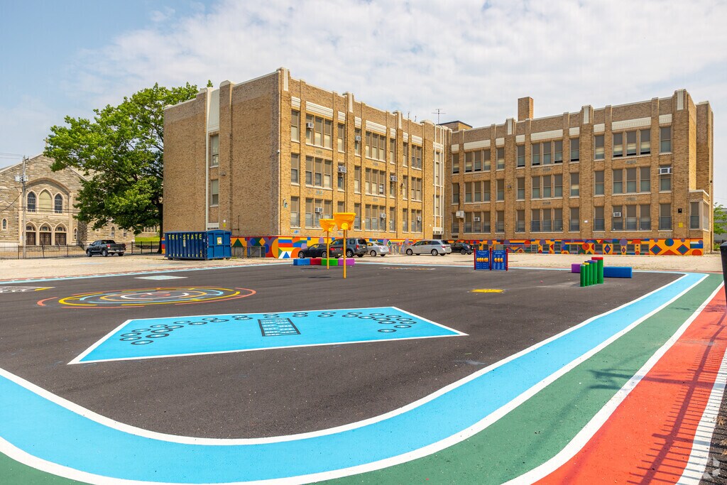 A paved area with games is a playground for Paschall students of J.W. Catharine School.