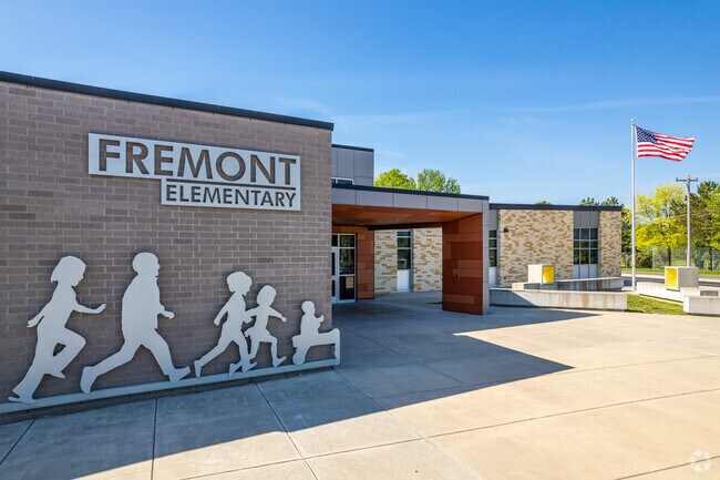 Students are greeted by a stainless steel wall mural at the entrance to Fremont Elementary School in the Doling Park neighborhood.