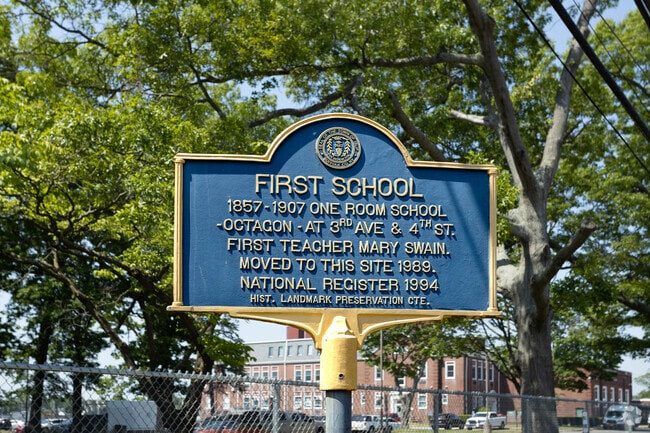 A historical sign is at the current location of the original schoolhouse in Brentwood, NY.