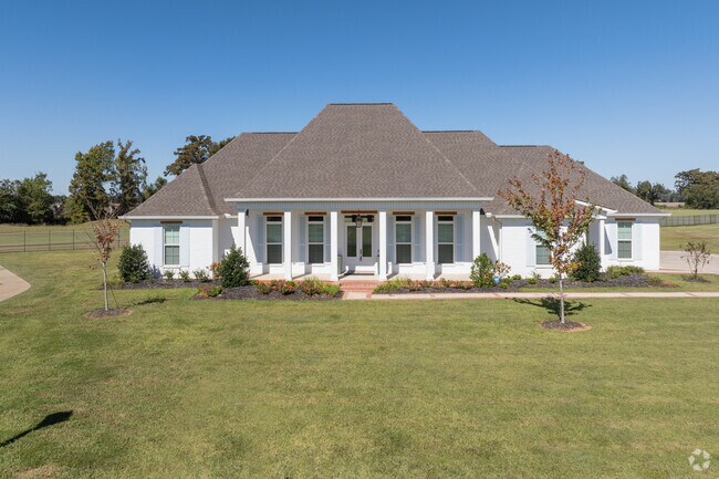Acadian houses are designed to be energy-efficient, with features that keep homes cool in summer