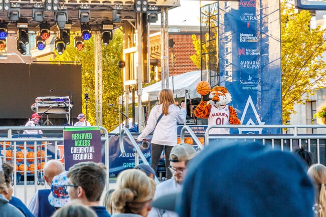 Residents of Stage Road come to the Tipoff at Toomers event to celebrate the basketball season.