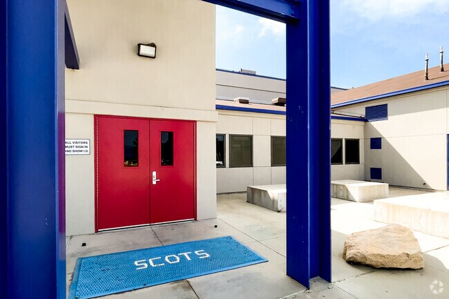 Bright red doors welcome you to Rim of the World High School of Lake Arrowhead.