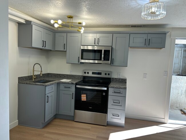 Not on the photo but kitchen comes with fridge and washer and dryer, all brand new appliances