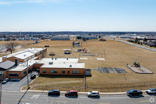 Michener Elementary School features a large play area behind the school for student recess.