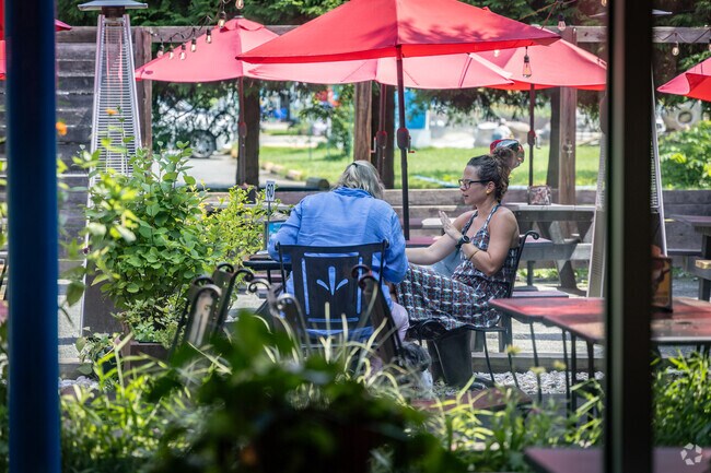 Friends meet for lunch on a beautiful summer day at Brazos Tacos in Ridge Street.