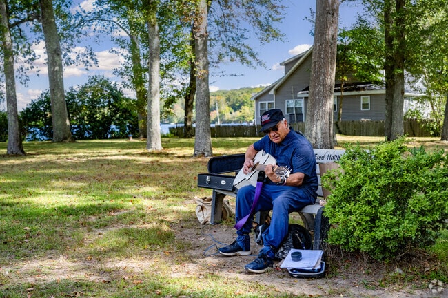 Locals can relax near the water on a park bench at Hains Park.