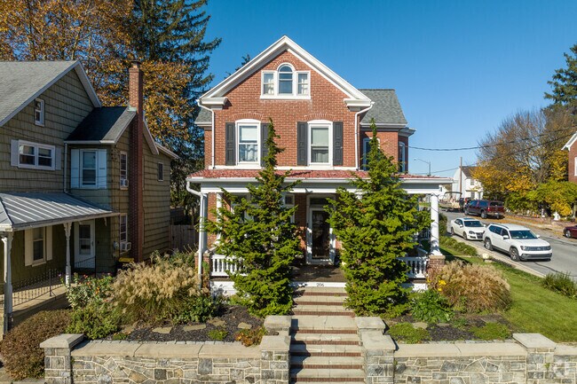 This brick farmhouse sits on a corner lot in the center of South Heidelberg.