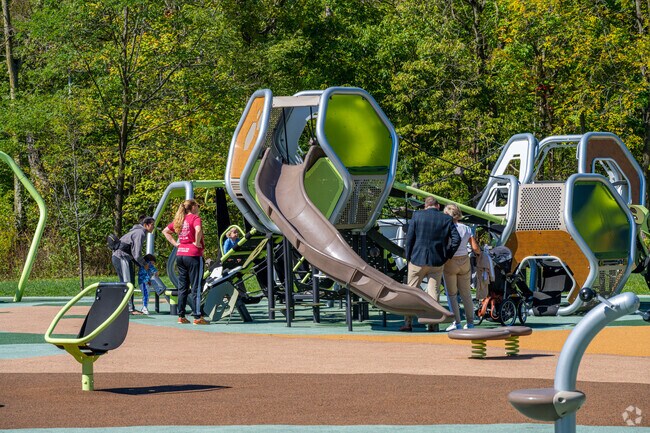 Children play in a futuristic looking playground at Downtown Carmel's Meadowlark Park.