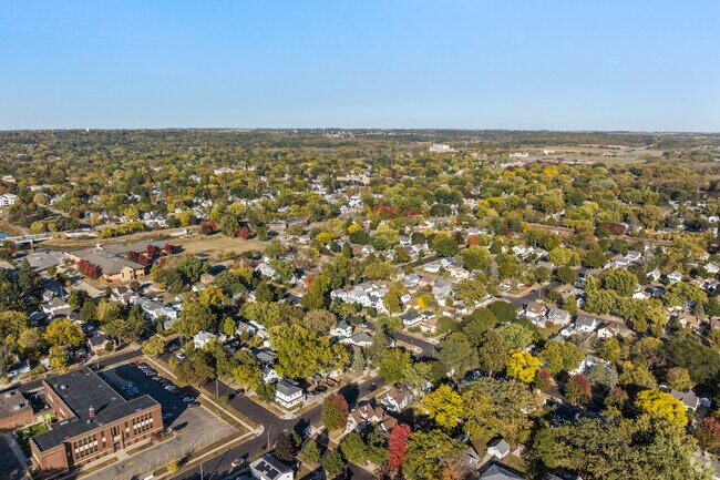 Slatterly Park offers beautiful aerial views, surrounded by lush trees and vibrant homes.