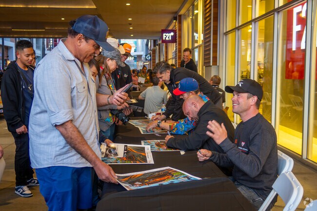 Getting autographs at the Thunder Thursday event before the Grand Prix.