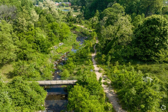 Enjoy the pedestrian bridge and walking paths in Chinquapin Park.