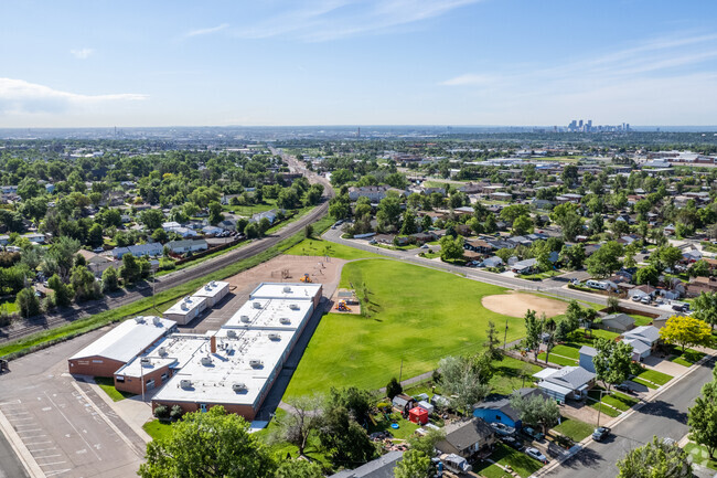 Harris Park Elementary in Westminster, Colorado with the Denver skyline beyond.