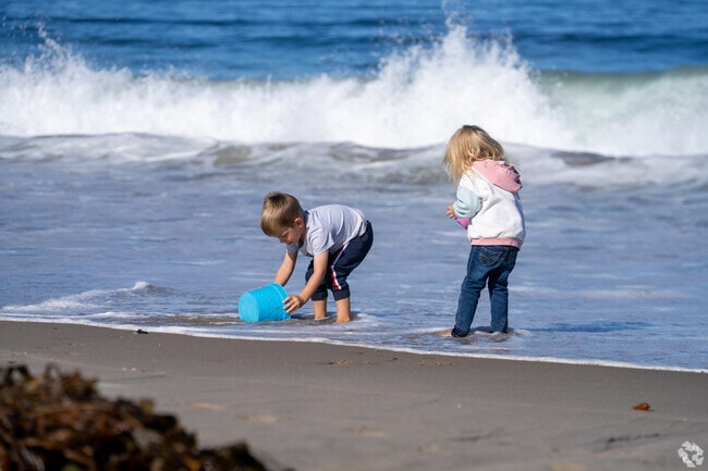 Children splash and play in the gentle surf just minutes from Casanova Oak Knoll’s quiet streets.