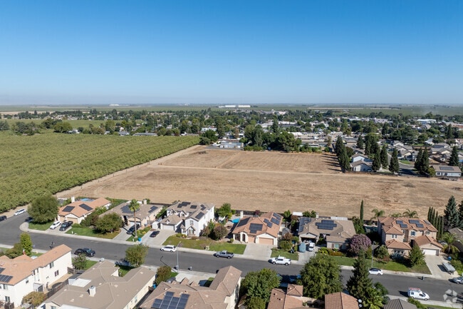 The neighborhood is surrounded by farmland, offering open views and fresh air.