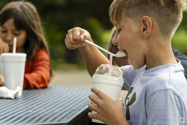 Locals from the Nicholls neighborhood enjoy ice cream on a hot summer day.