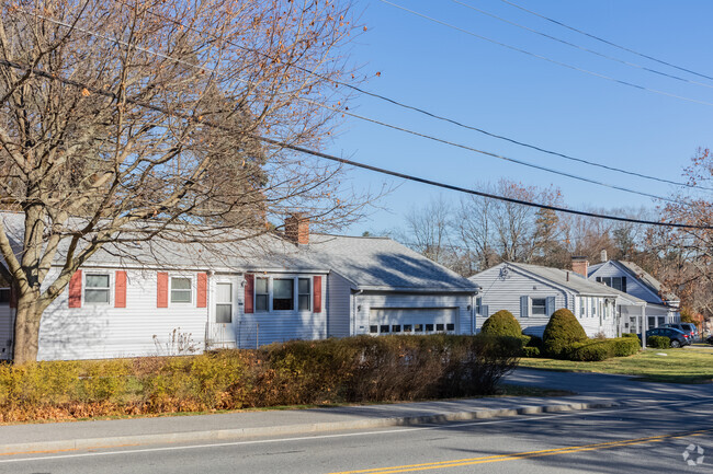 A neat row of Robert Ranches homes, a vision of suburban elegance and community.