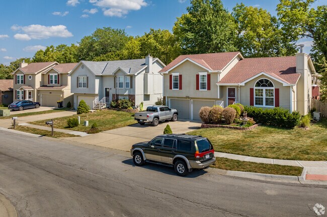 Split-level homes with small front yards line the streets of Claycomo.