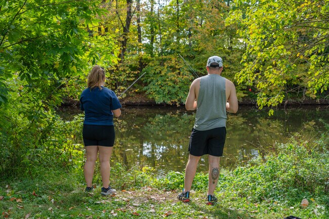 Residents in Salford Township drop a line in the East Branch Perkiomen Creek by Branchwood Park.