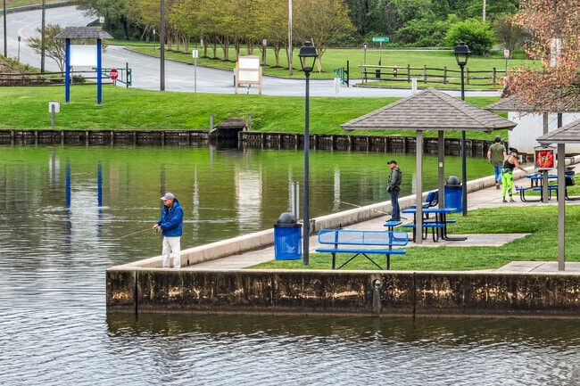 Deep River residents fish from the banks of Oak Hollow Lake for bass and catfish.