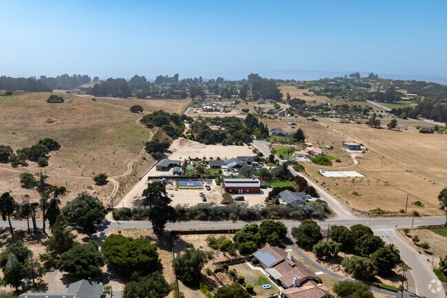 An aerial view of several properties side by side in Los Berros.