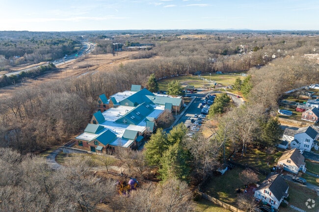 The Dr. Gertrude Bailey Elementary and it's playground in the foreground School in Lowell, MA.
