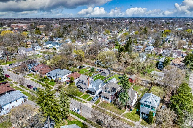 The Old Forest neighborhood is lined with traditional style homes along tree-lined streets.