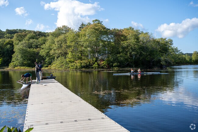 Rowers practice on Pattagansett Lake.