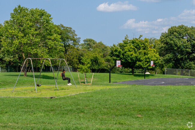 Children enjoy the swings with open space at Horton Park in Shenandoah West.