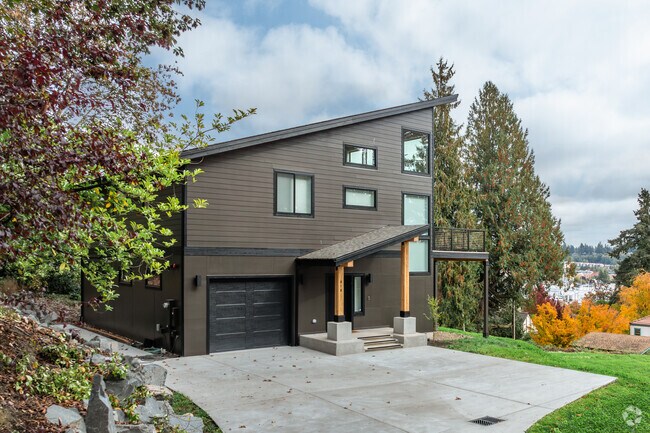 A spacious modern home sits hills side with harbor views in South Westside.