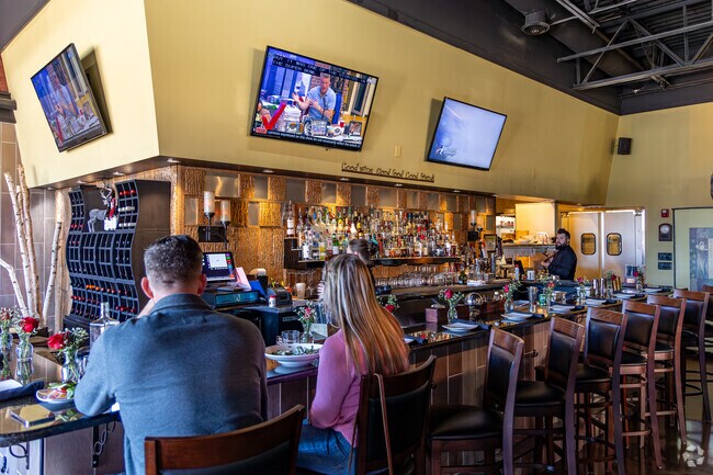 Diners enjoy seasonal dishes at Seasons Innovative Bar & Grill near Concord.