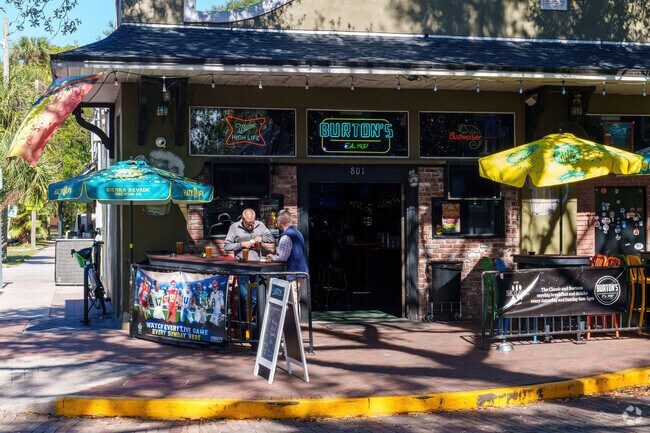 Patrons have a beer on the outdoor patio of Burton's.