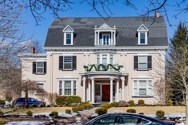 Colonial inspired large homes tower over the streets in Cumberland.