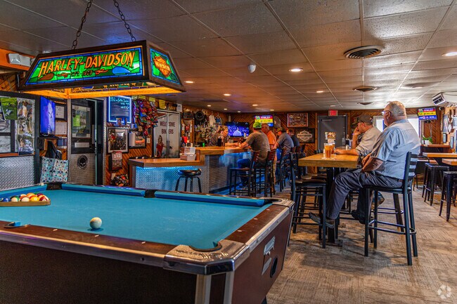 Tyrone Township friends enjoy the dive bar atmosphere at Kent City Lounge.