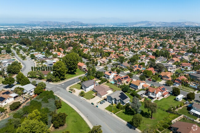 The streets in South Corona are well maintained and have lush greenery.