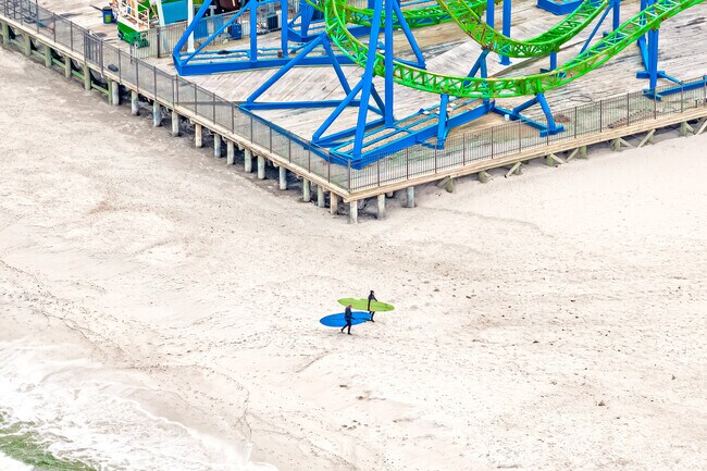 Adventurers chase waves and thrills just steps apart in Seaside Heights, where the beach meets the boardwalk in perfect harmony.
