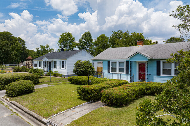 Colorful compact cottages line the streets of Victory Heights.