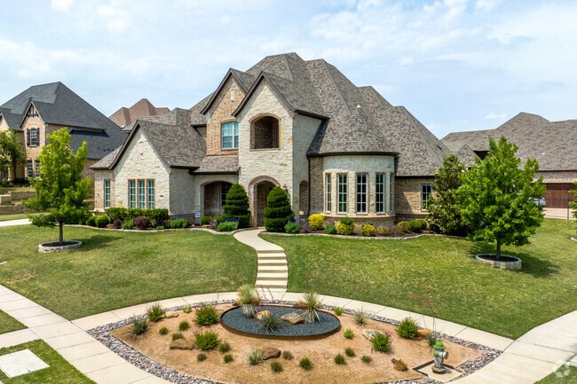 Homes in Trophy Club incorporate unique features like turret windows and sharp, pointed roofs.