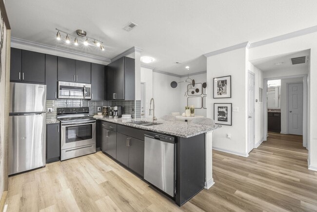 Two Bedroom - kitchen with stainless steel appliances and granite countertops