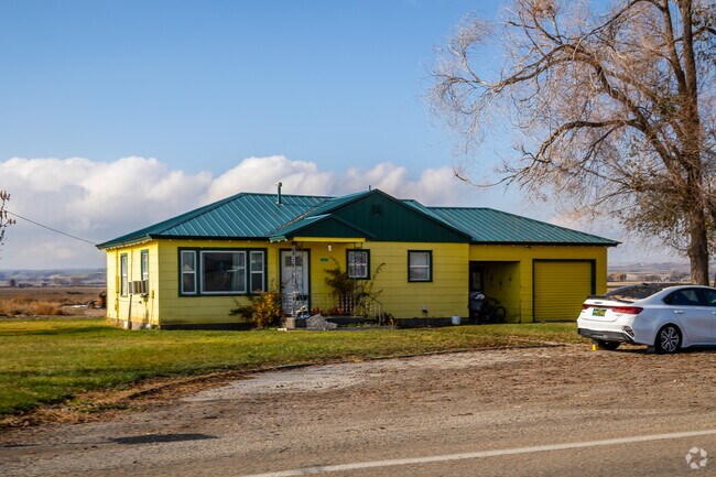 Ranch-style home on a quiet Nyssa road surrounded by farmland.
