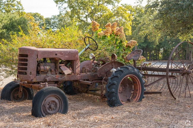 Several retired farm tractors decorate the roadways of Albion Acres.