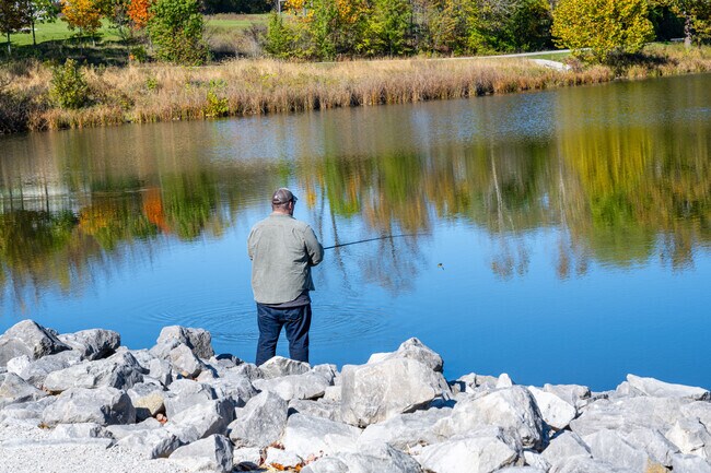 An Avon resident fishing at Lake View in Avon Town hall Park, Avon.
