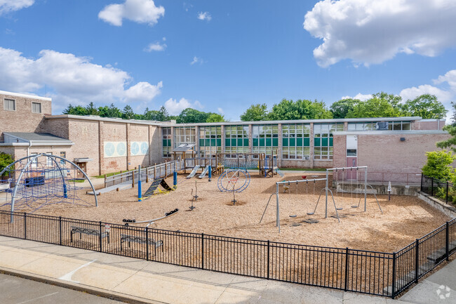 Students enjoy playing on the playground at All Saints Catholic School in Norwalk.