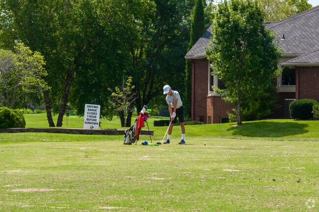 Practice your swing at the Reflection Ridge Driving Range.